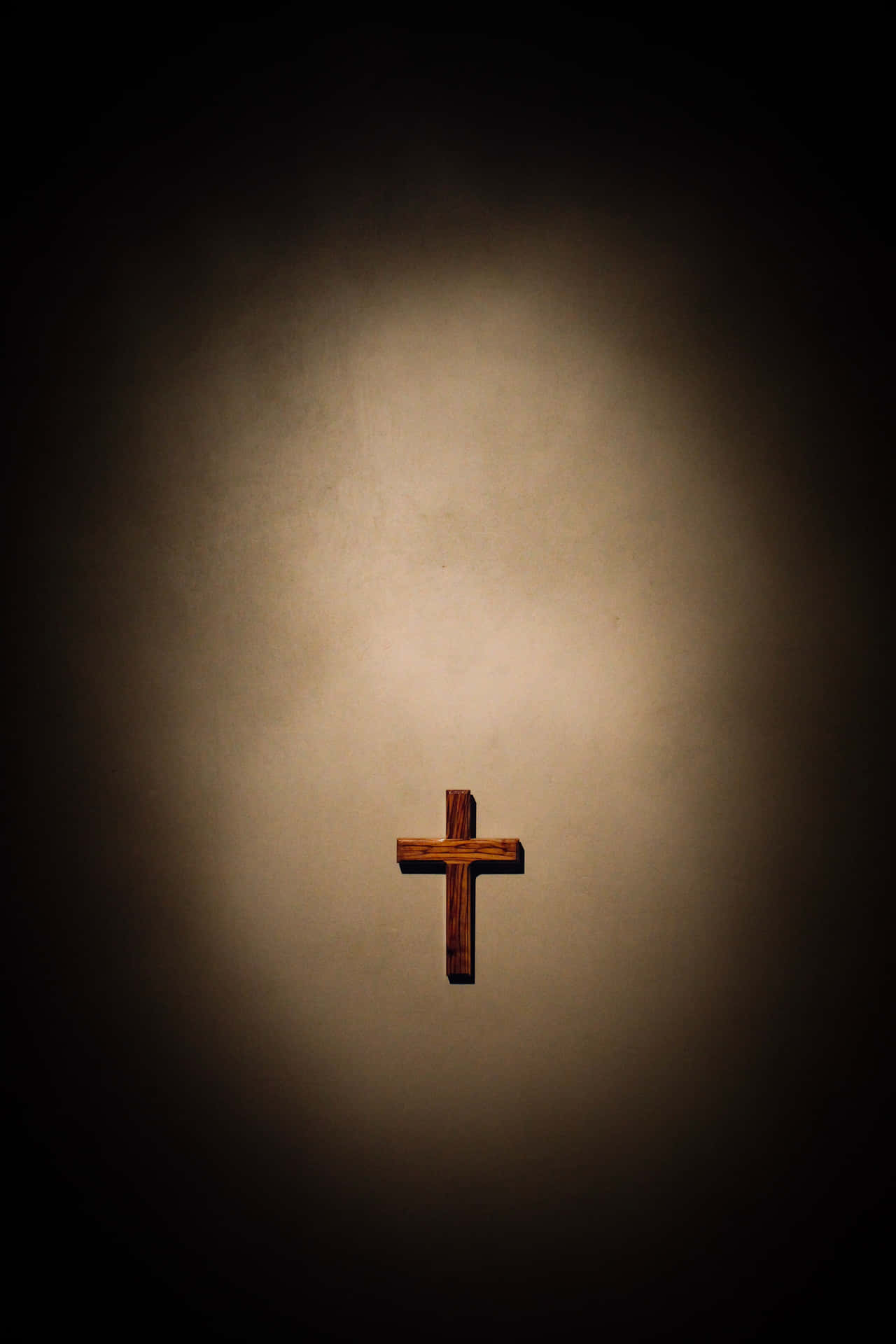 Image  An ethereal image of a cross silhouetted against the sky. Wallpaper