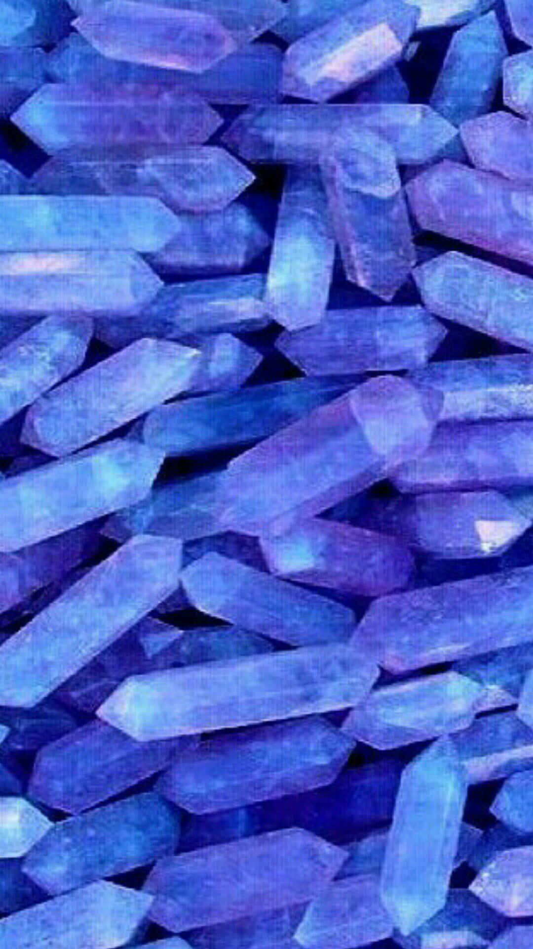 A Close Up Of A Bunch Of Blue Crystals Wallpaper