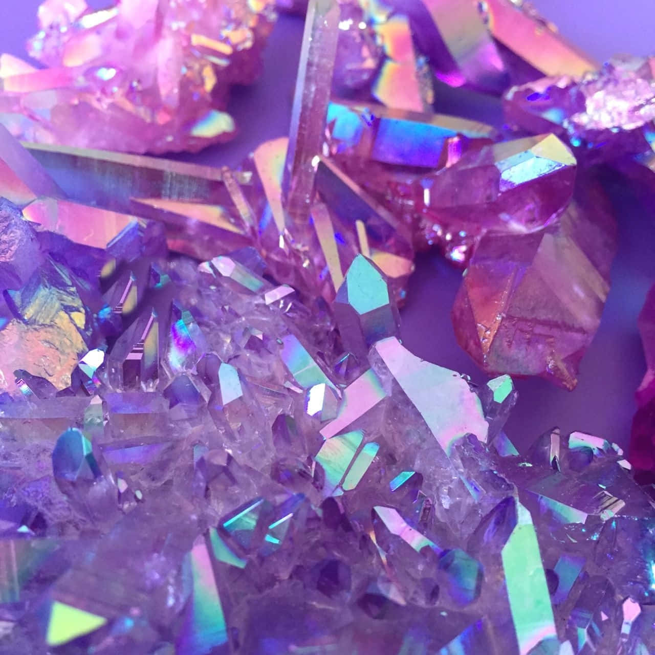 A Pile Of Crystals On A Purple Surface Wallpaper