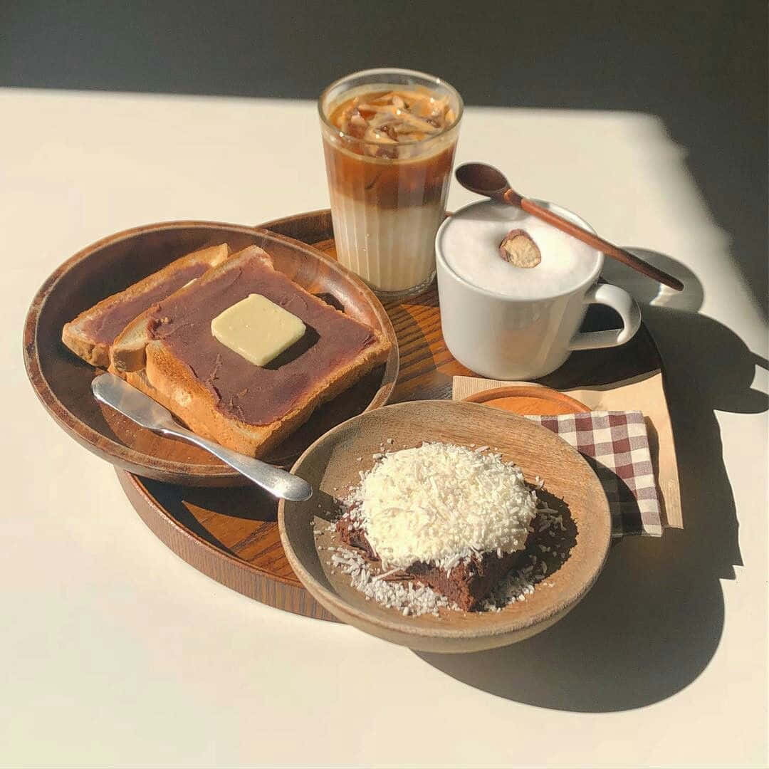 A Plate With Coffee, Toast, And A Cup Of Coffee
