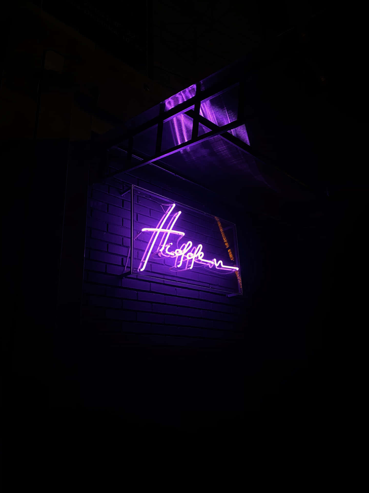 A Neon Sign With A Purple Light Wallpaper