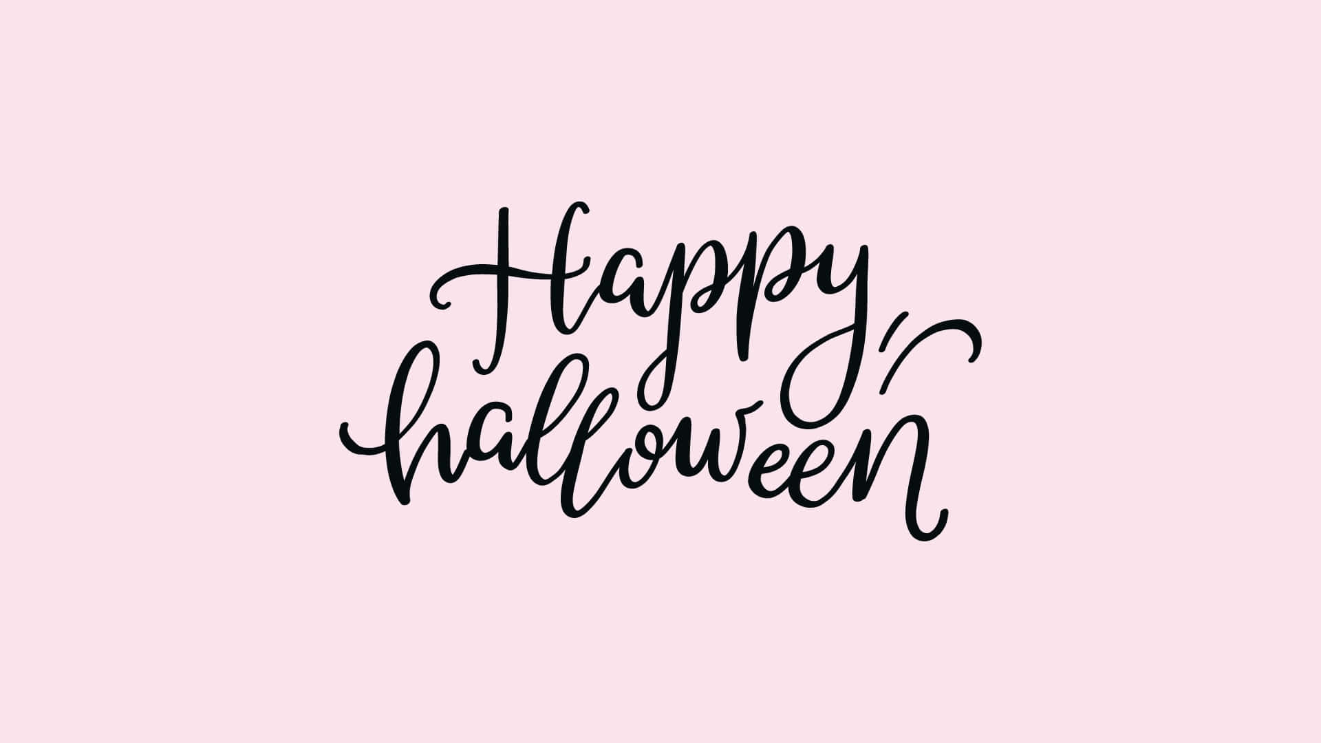 Happy Halloween håndskrevne bogstaver på en pink baggrund