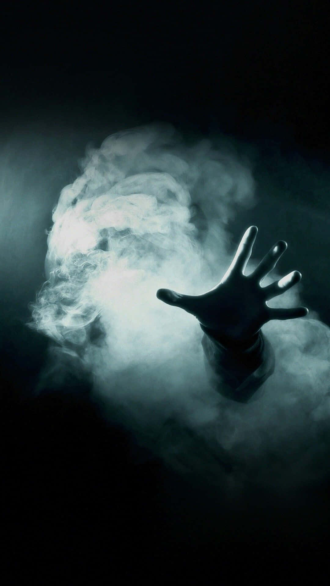 A Hand Is Reaching Out Of The Smoke Wallpaper