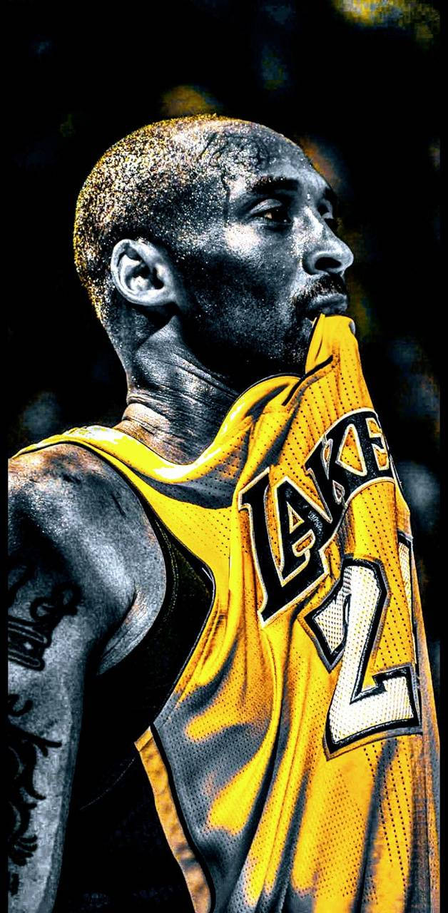 Aesthetic Kobe Bryant Side Profile Biting His Jersey Wallpaper
