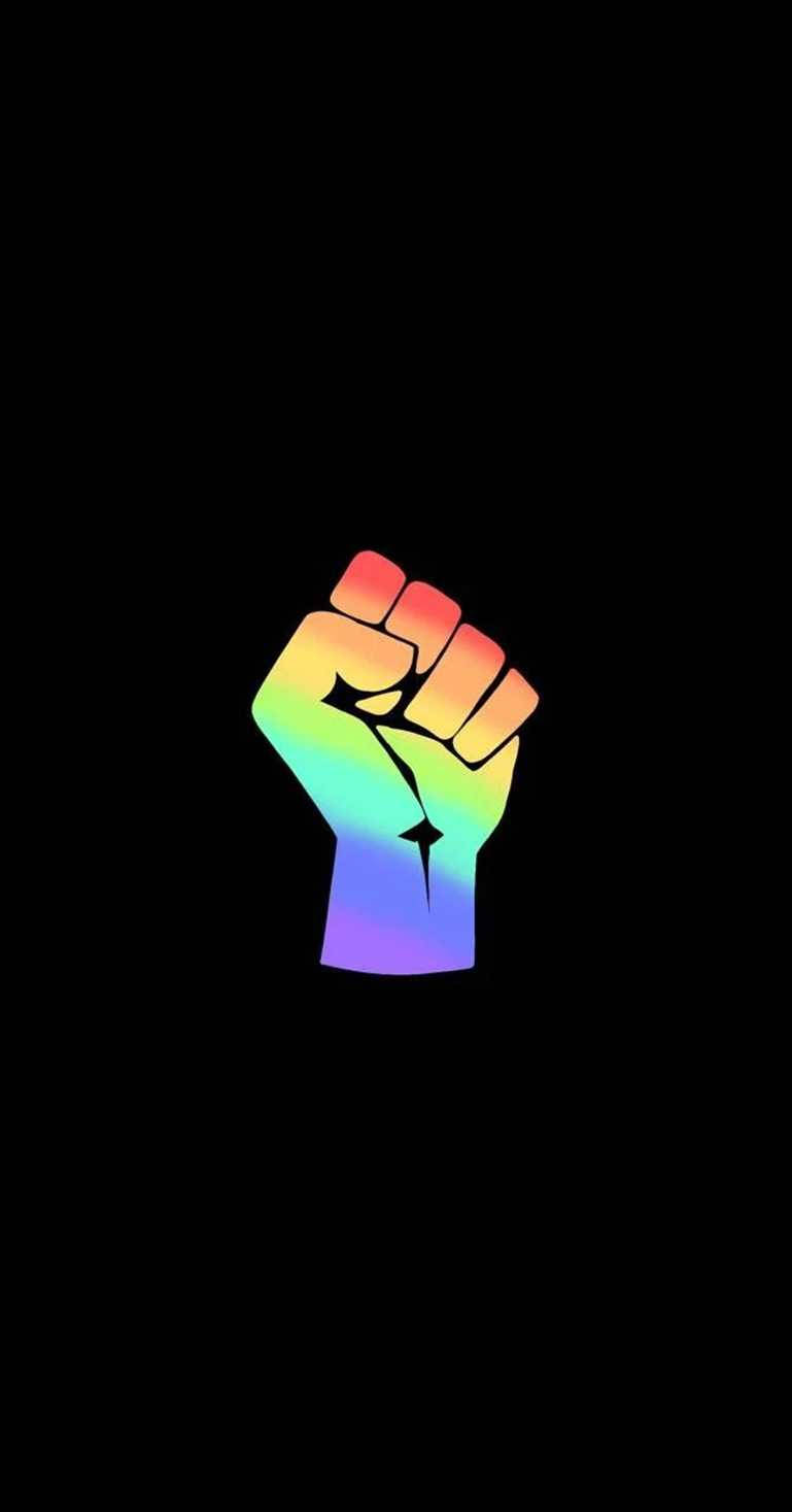 A Rainbow Fist On A Black Background Wallpaper