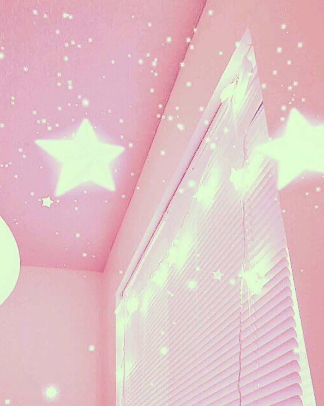 a pink room with stars on the ceiling
