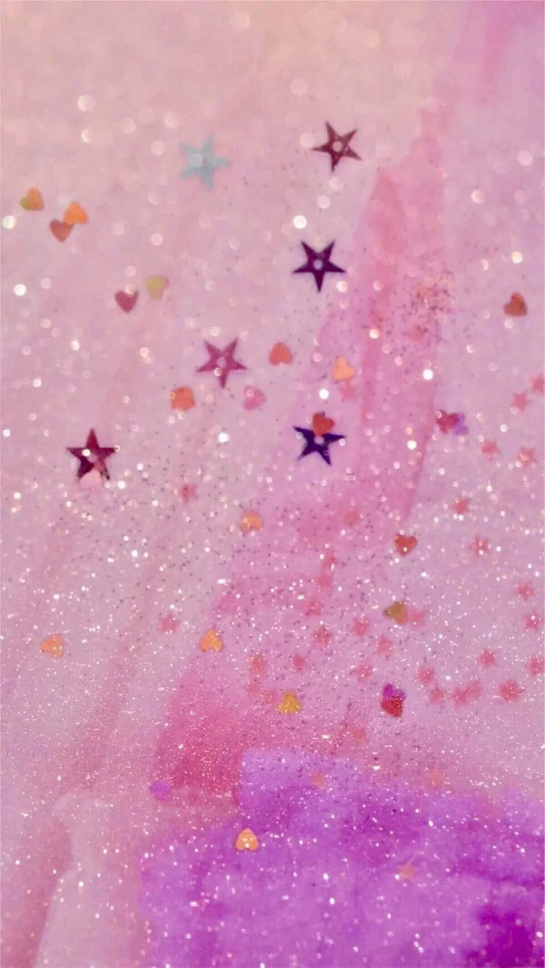 a pink and gold glittery background with stars