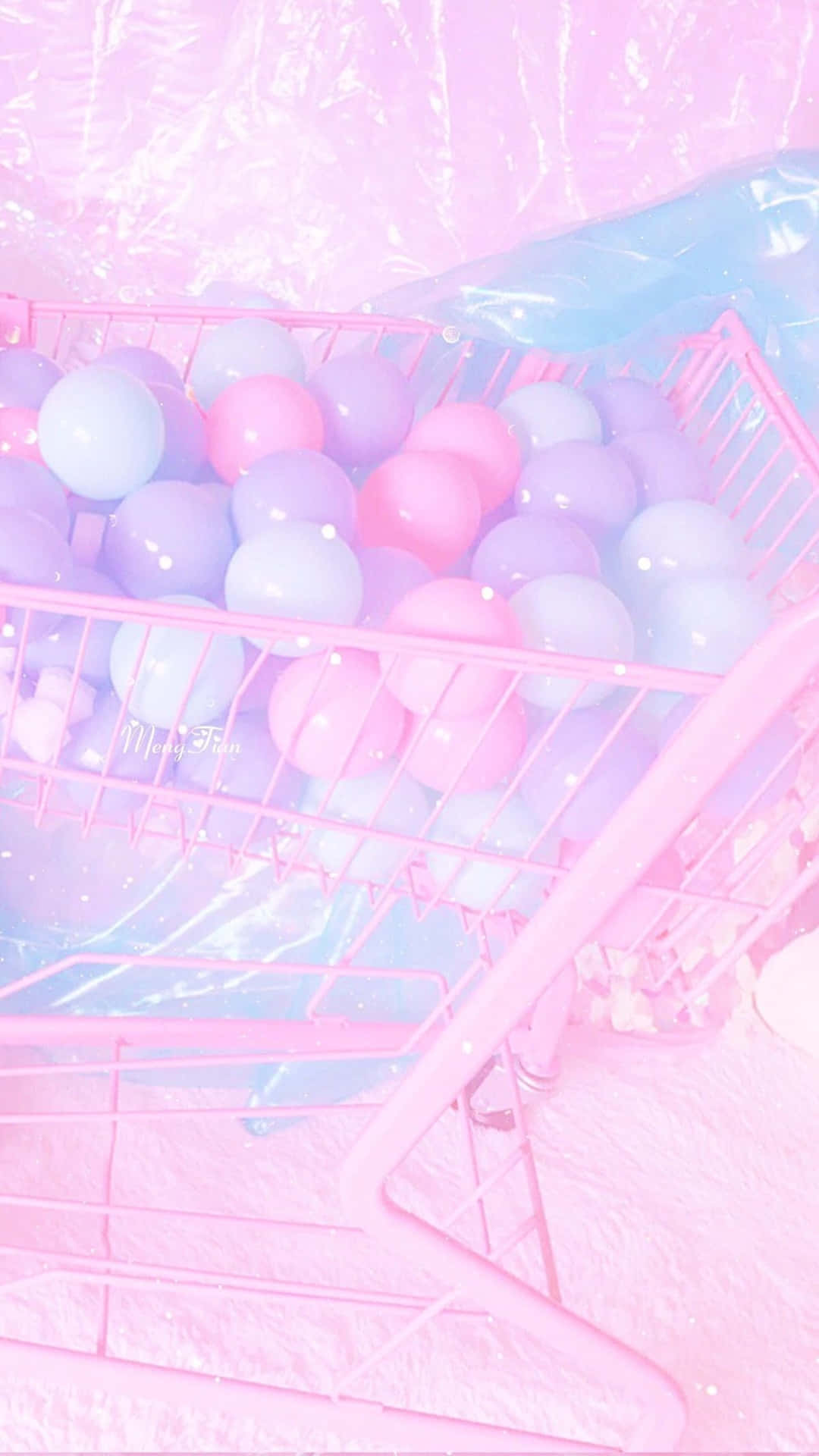 a pink shopping cart with pink and blue balloons