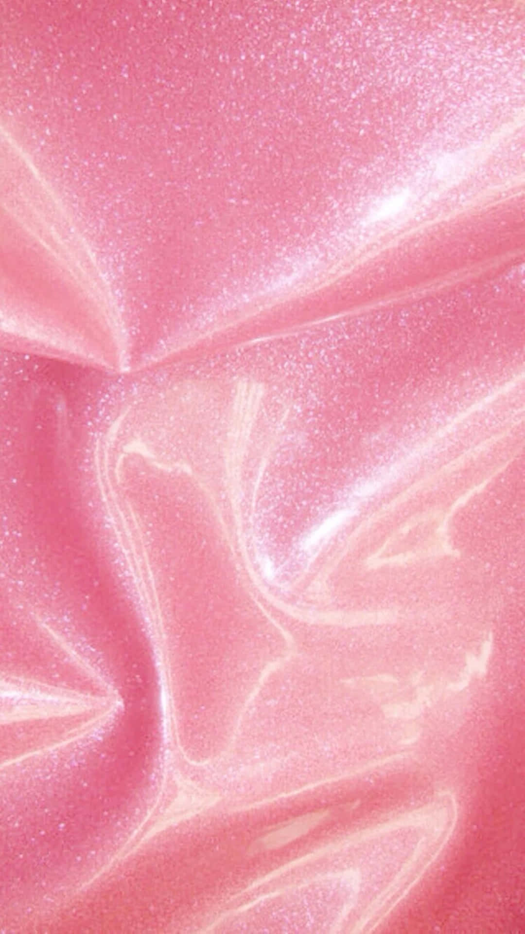 a pink glitter fabric with a shiny surface