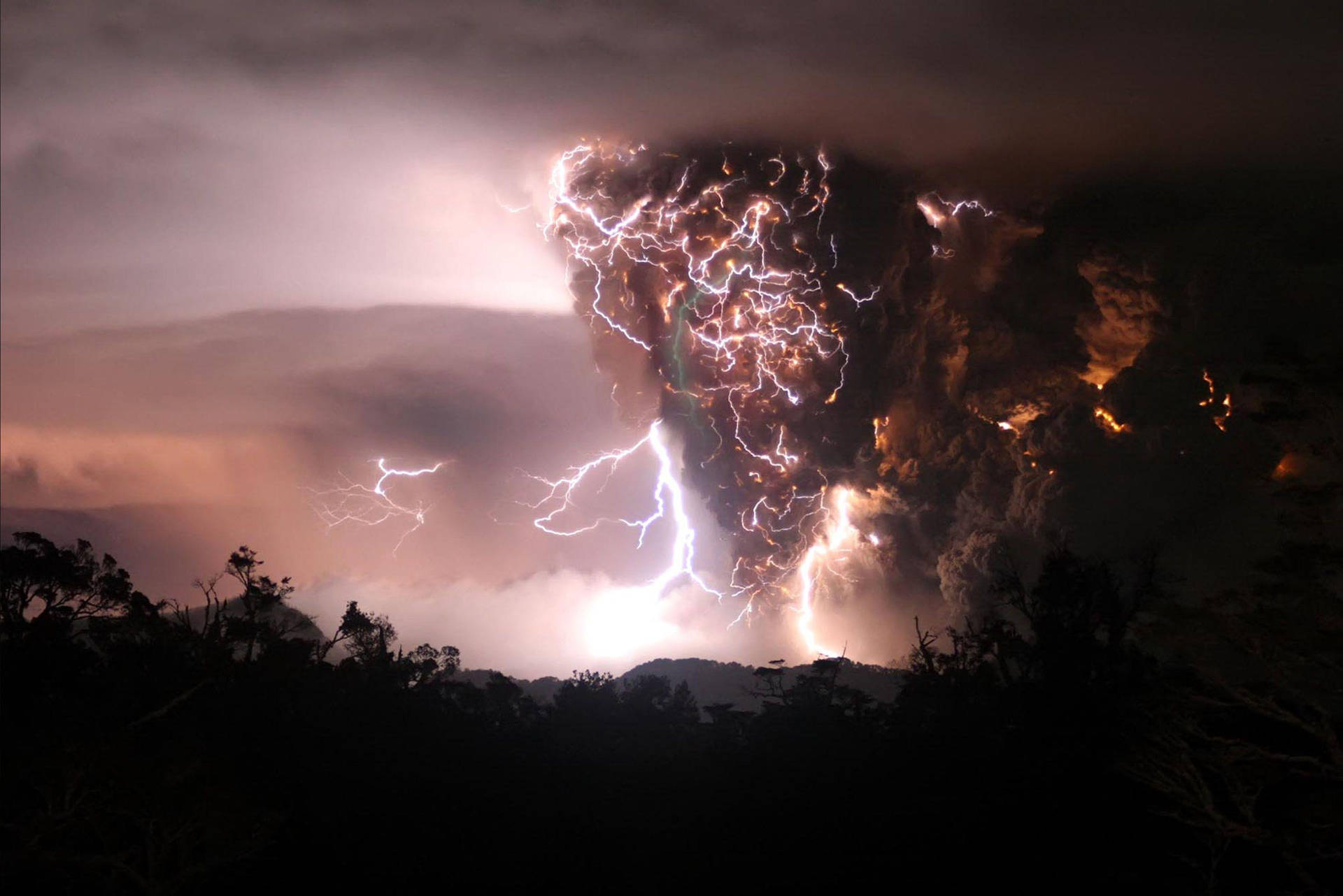 Lightning Strikes Over A Volcano In The Night Wallpaper