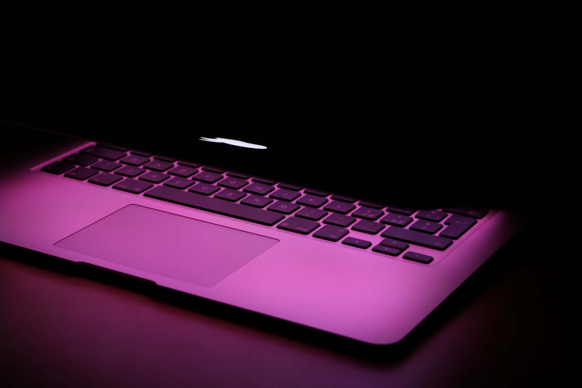 A minimalist aesthetic design featuring a Macbook laptop