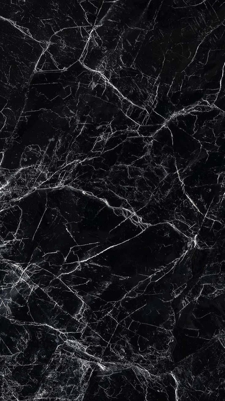 A Black Marble Tile With White Streaks