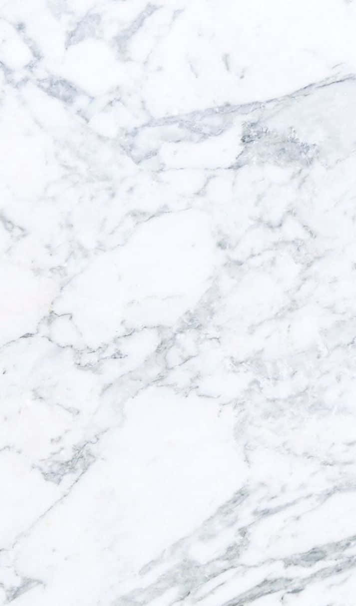A White Marble Background With A White Cat