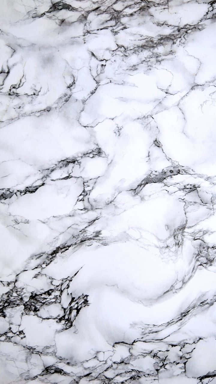 A White Marble Tile With Black And White Patterns
