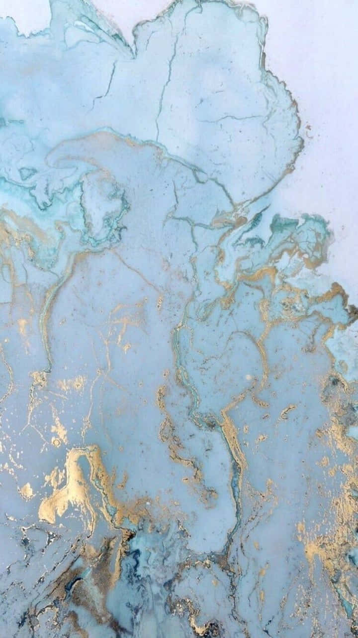 A Painting With Gold And Blue Paint On It