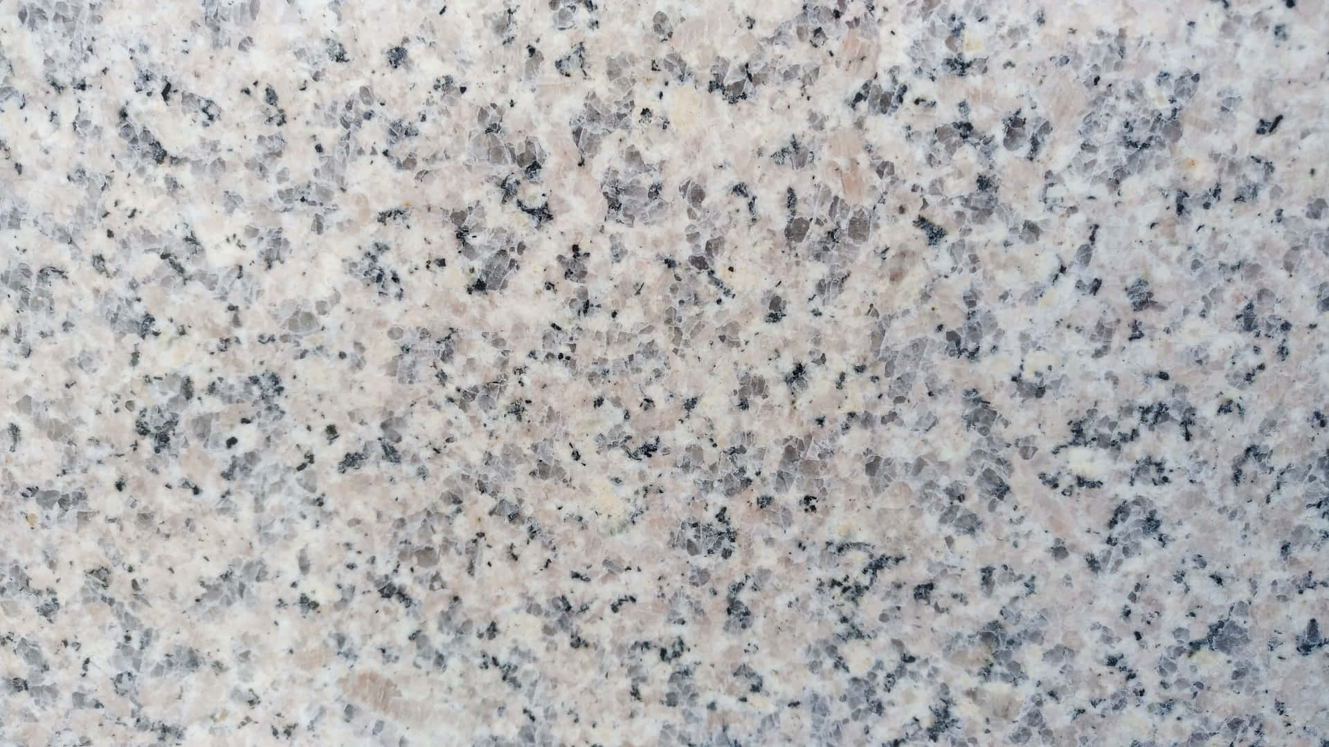 A Close Up Of A White Granite Surface Wallpaper
