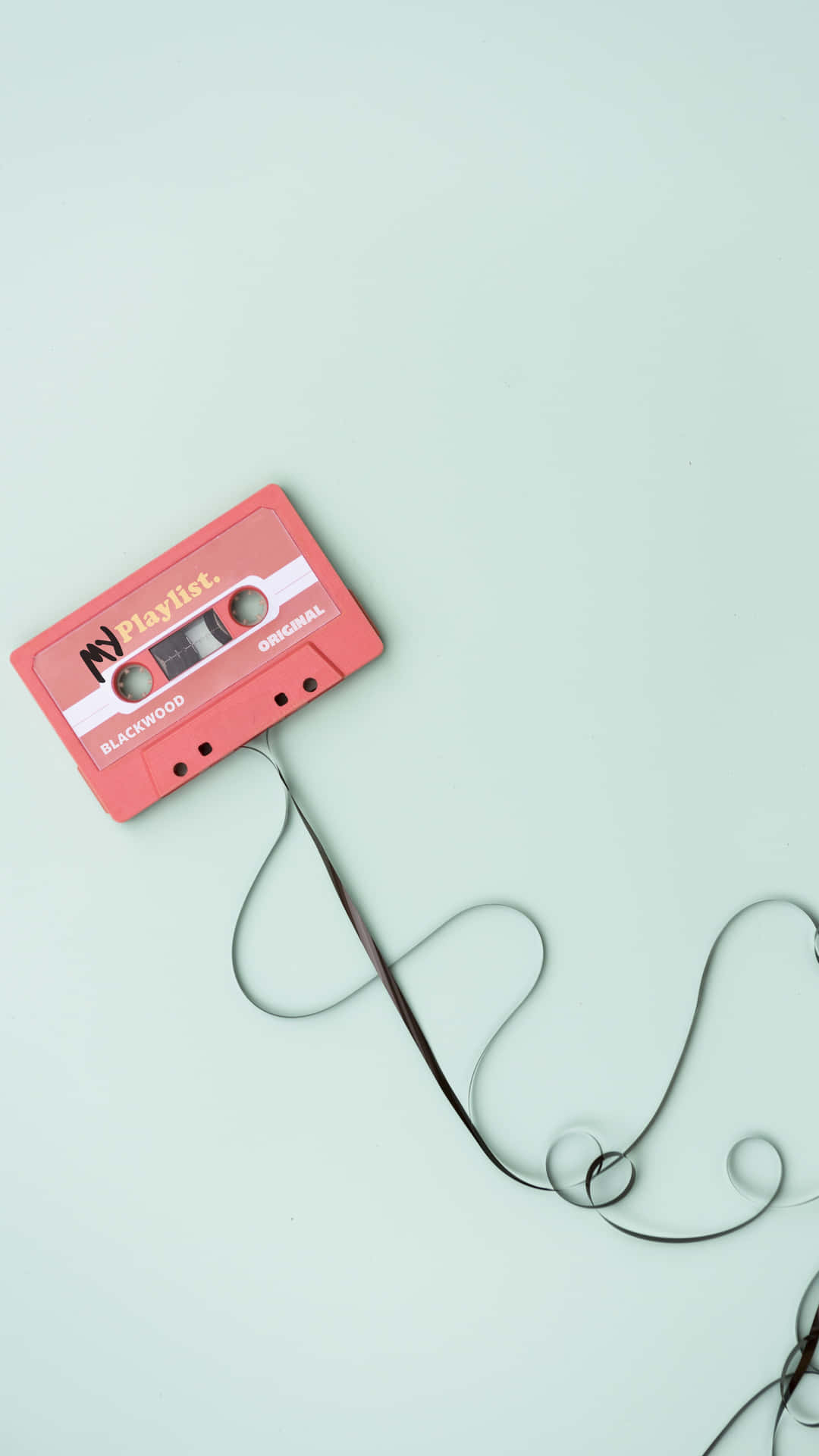 A Cassette Tape Is Connected To A Wire