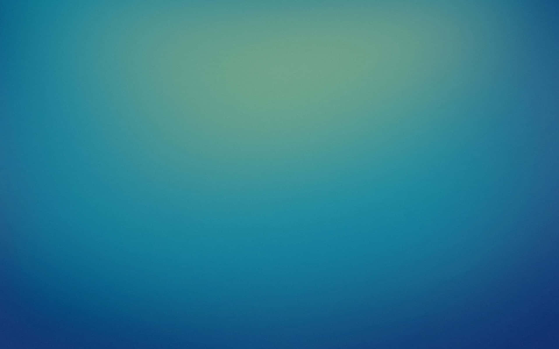 A Blue And Green Blurred Background Wallpaper