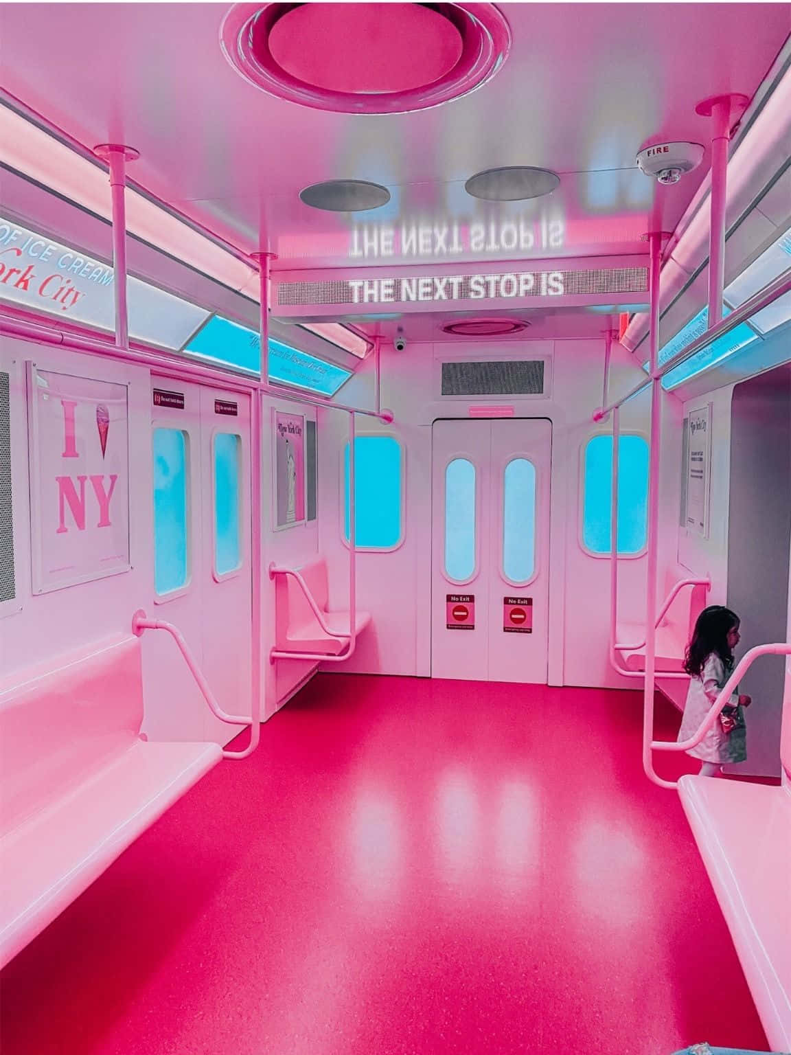 A Pink Subway Car With A Pink Sign