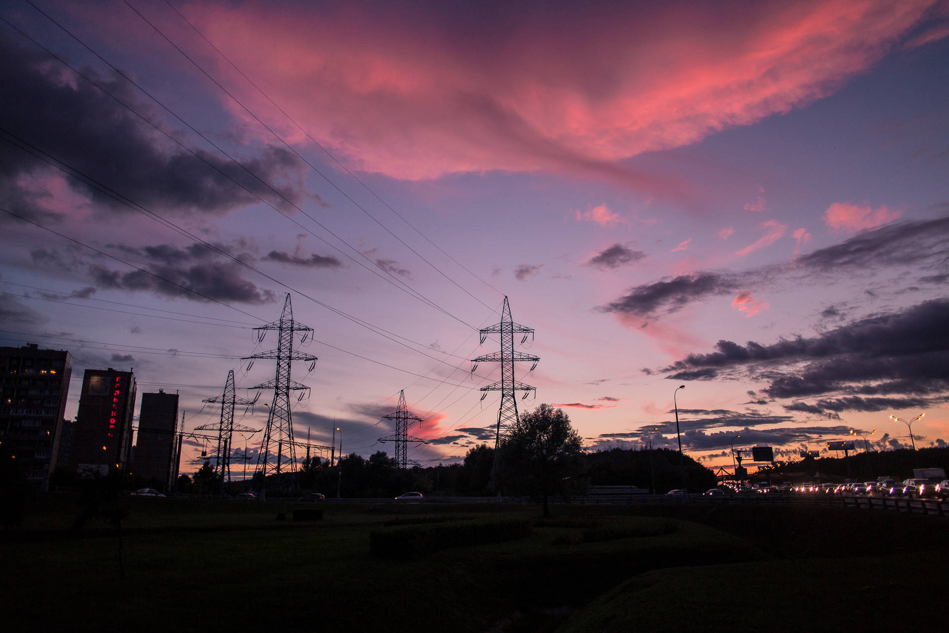 Aesthetic wallpaper of a photography of electrical posts silhouette under pink sky. 