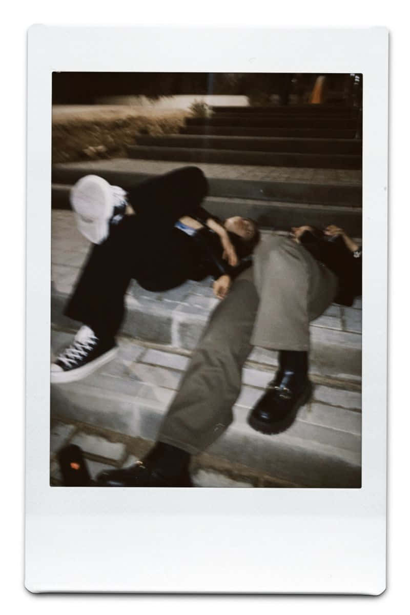 Two People Laying On The Steps