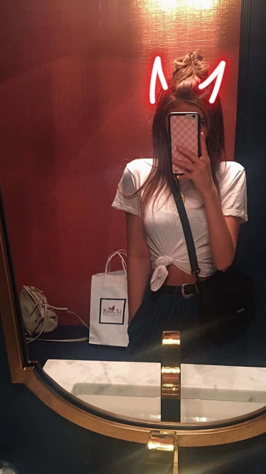 A Woman Taking A Selfie In A Bathroom Mirror Wallpaper