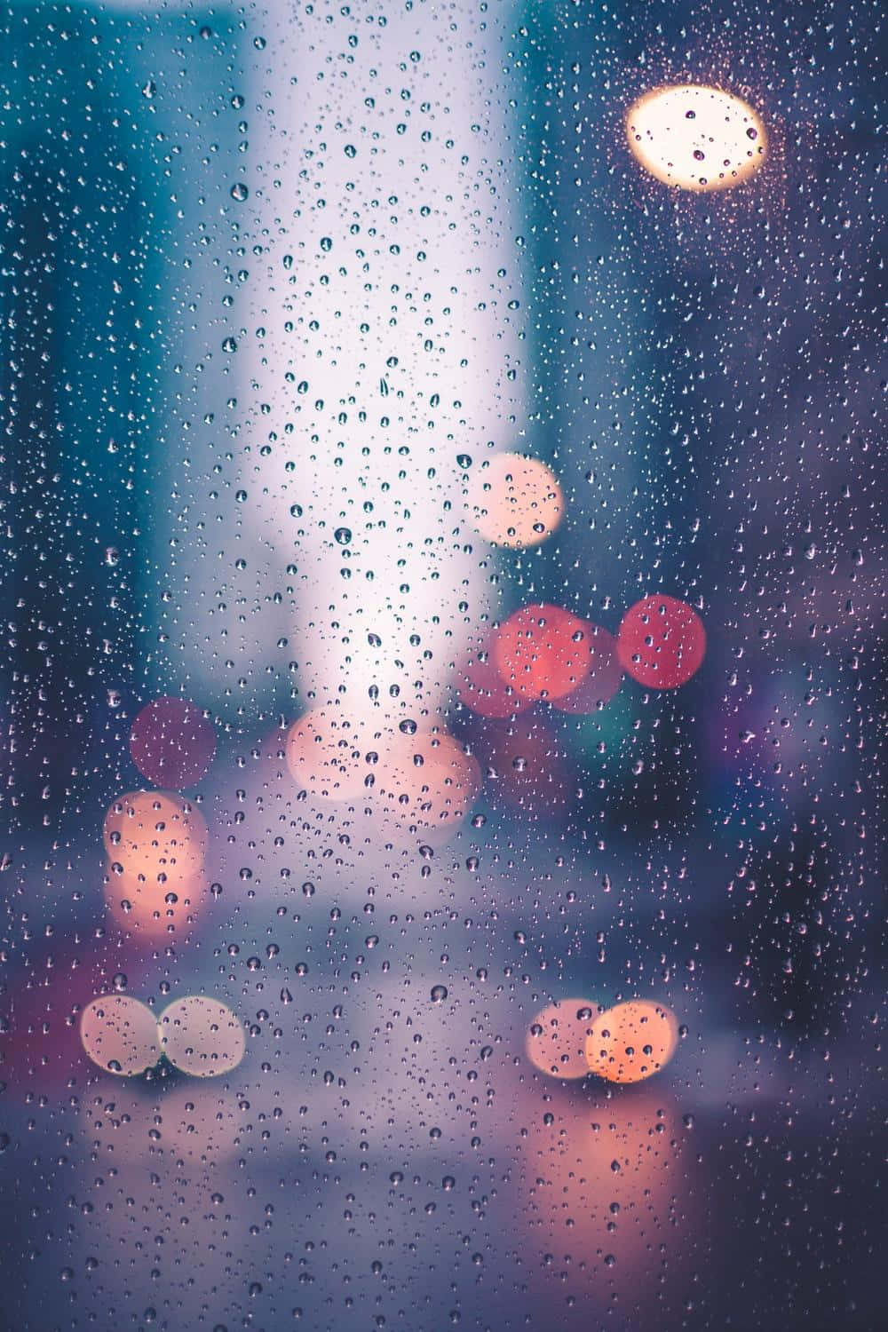 Aesthetic Raindrops On City Window Wallpaper