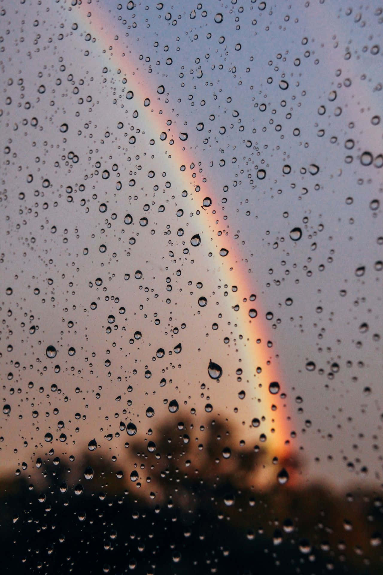 Aesthetic Rainbow Behind Wet Window Wallpaper