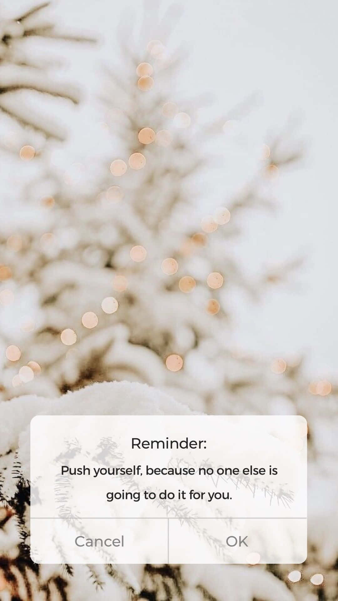 A Snowy Tree With The Text Reminder Wallpaper