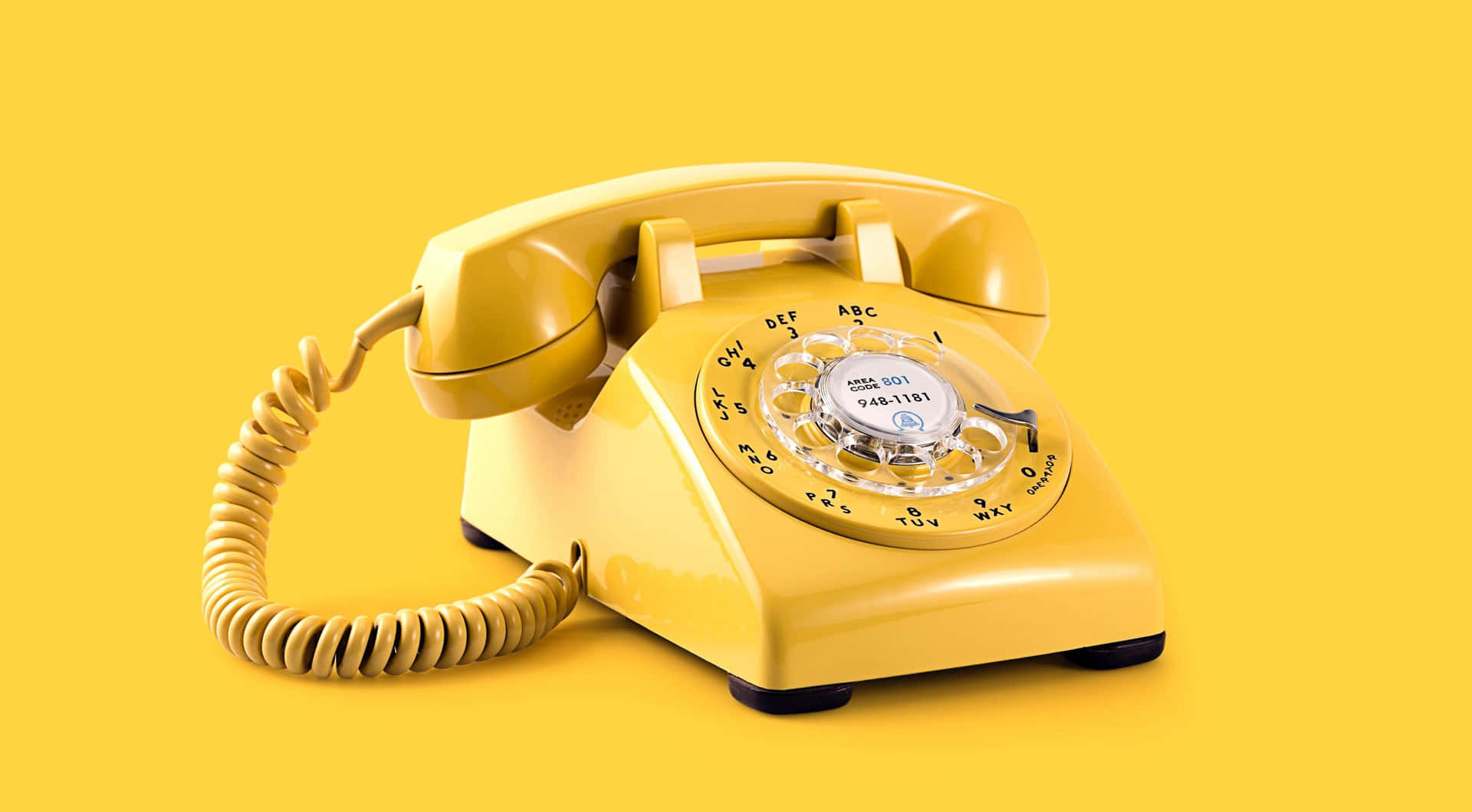 A Yellow Telephone On A Yellow Background Wallpaper