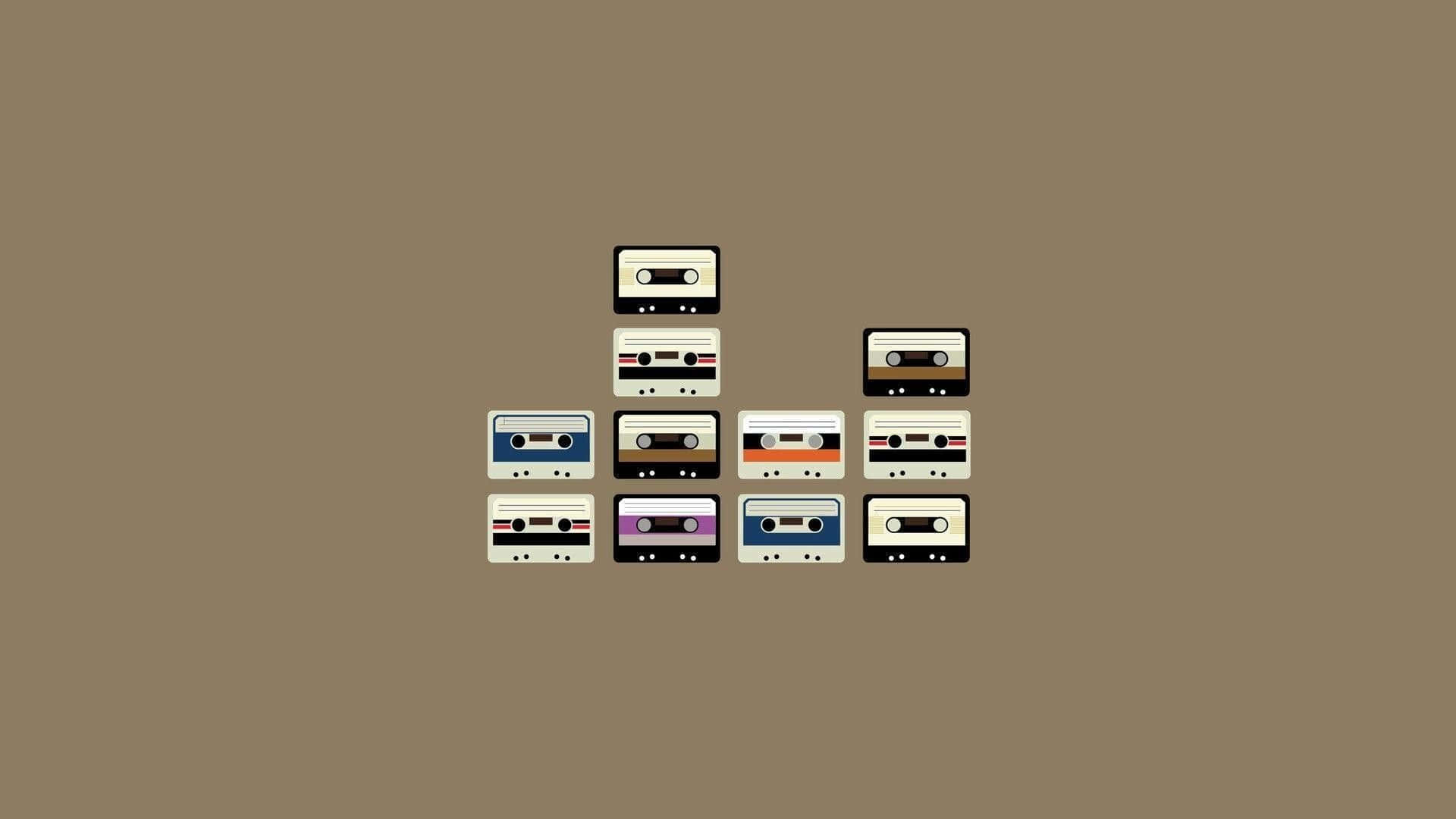 En bunke af kassettebånd på en brune baggrund Wallpaper