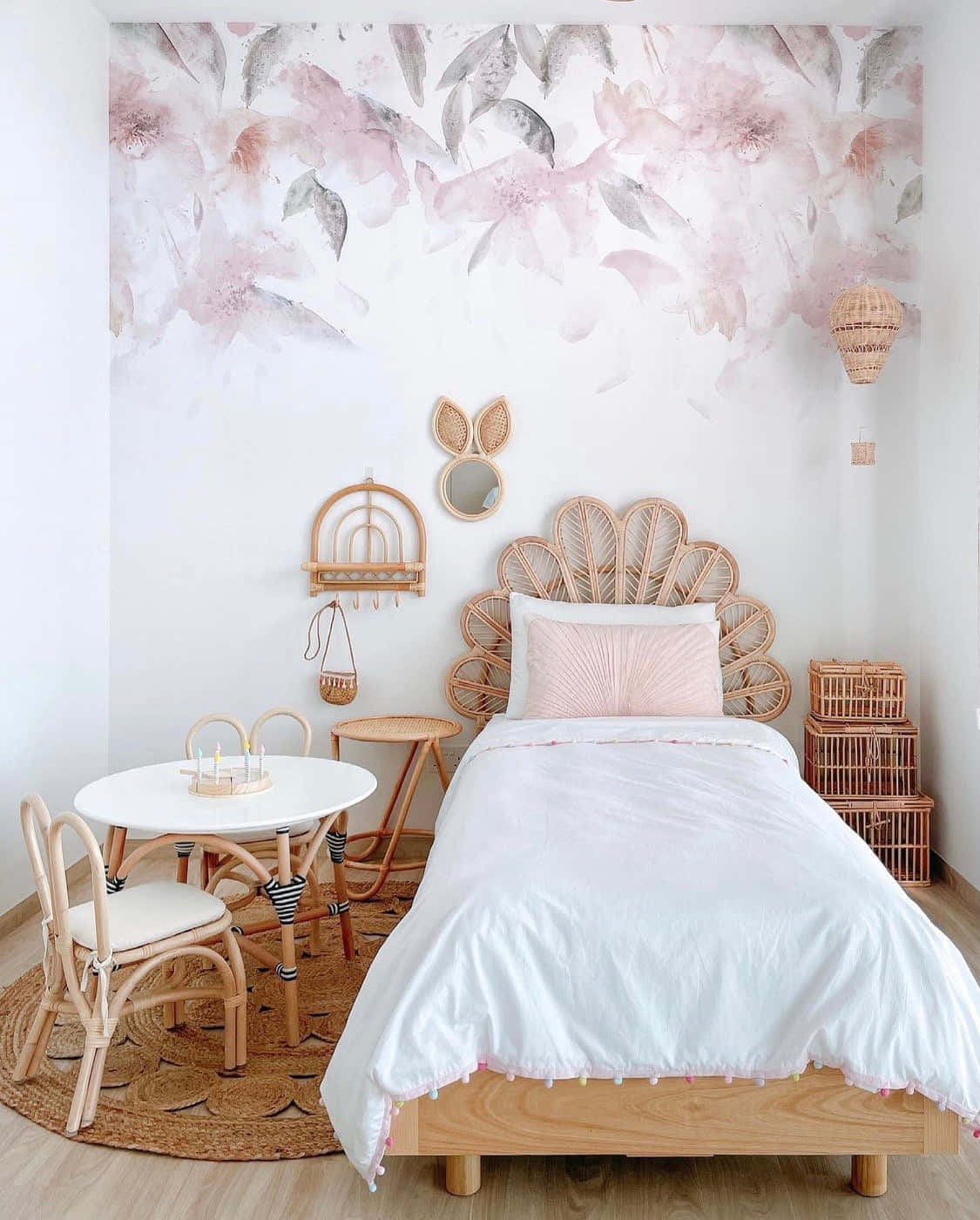 A Bedroom With A Pink And White Floral Wallpaper