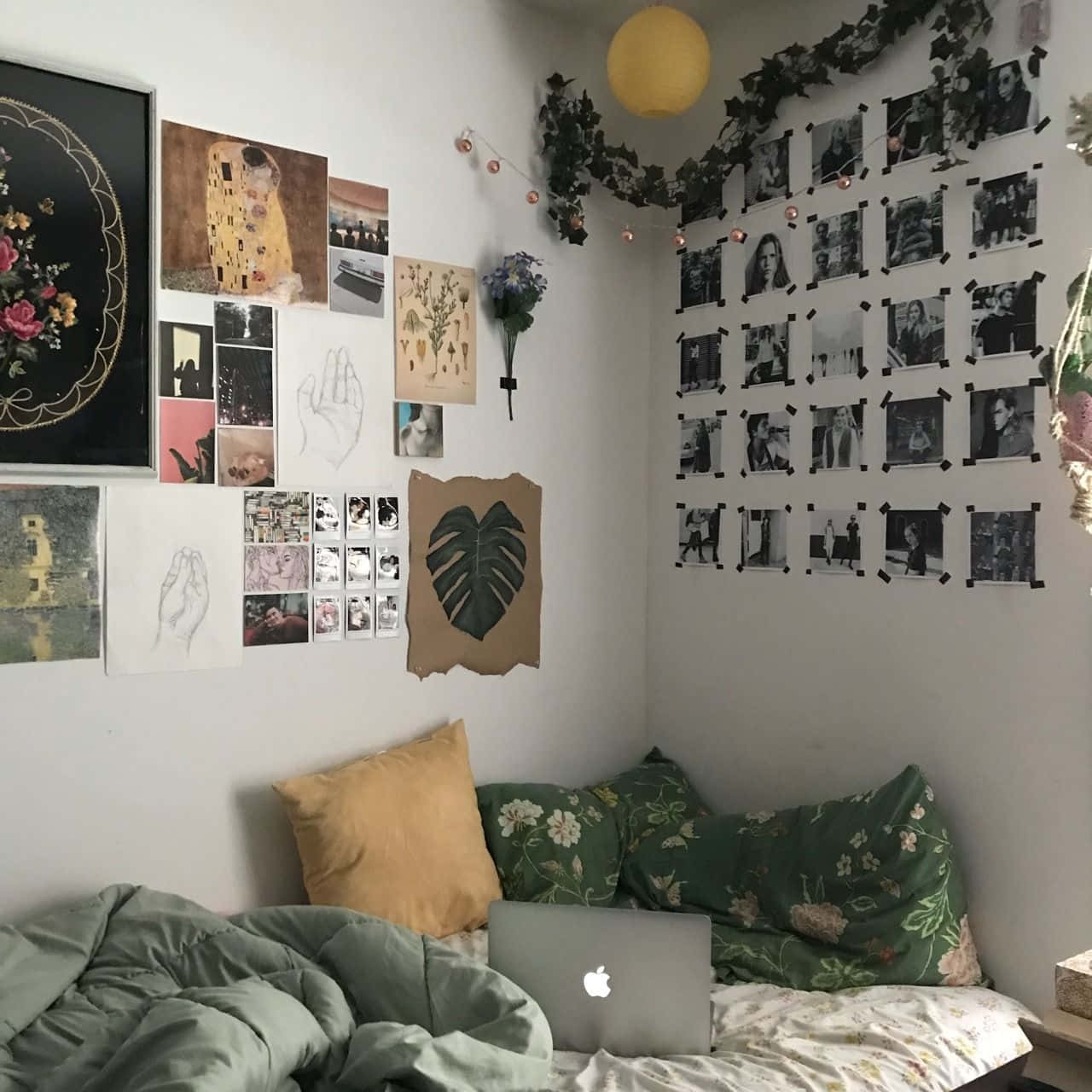 A Dorm Room With A Bed, A Laptop, And Pictures