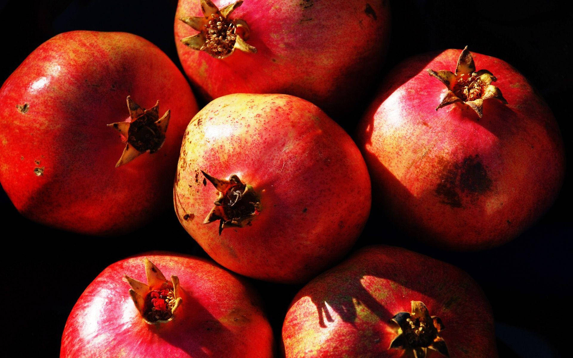 Aesthetic Up Close Photography of Six Pomegranates Wallpaper