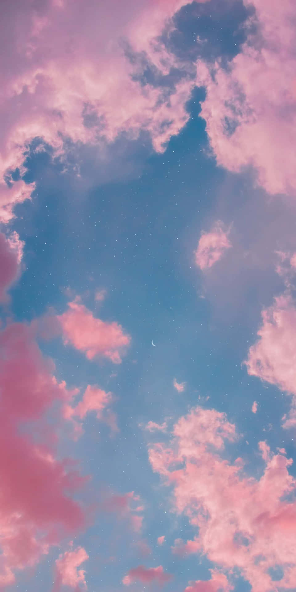 A Pink Sky With Clouds And A Moon