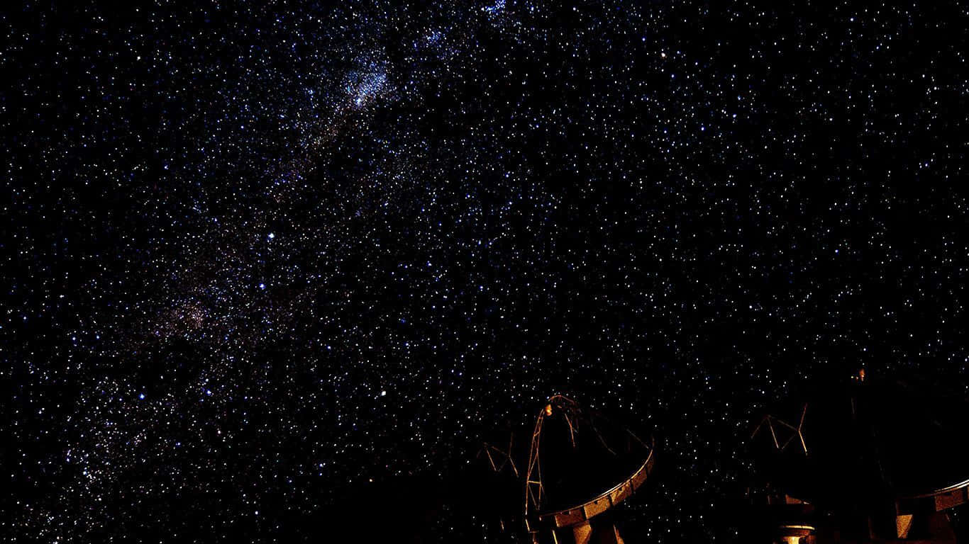 Uncielo Nocturno Con Un Cielo Estrellado Y Un Telescopio. Fondo de pantalla