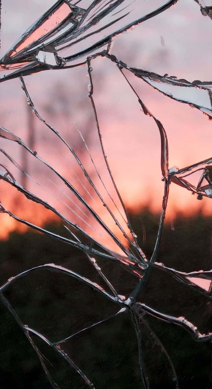 Erlebedie Ruhe Der Natur Mit Diesem Ästhetischen Sonnenuntergangs-iphone-hintergrundbild! Wallpaper