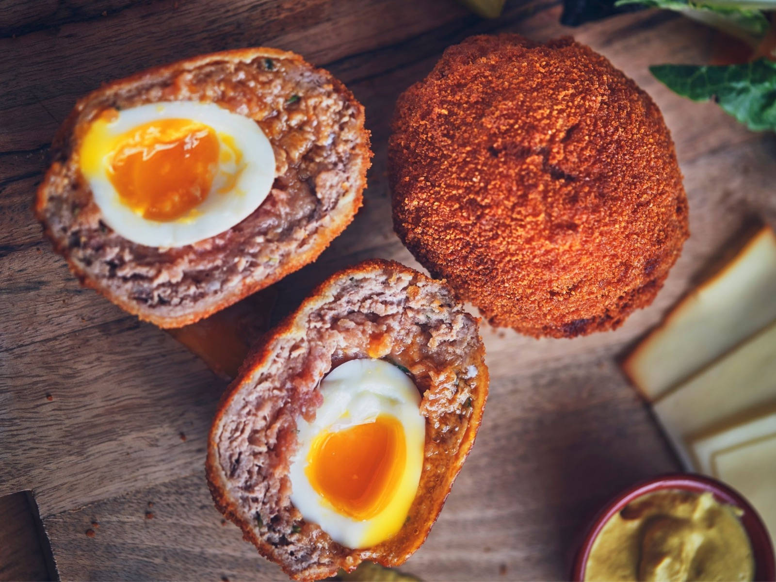 Estetisktraditionell Brittisk Scotch Eggs-rätt Med Ost. (note: This Translation Does Not Relate To Computer Or Mobile Wallpaper, As There Is No Provided Context For The Translation To Be Applied To.) Wallpaper