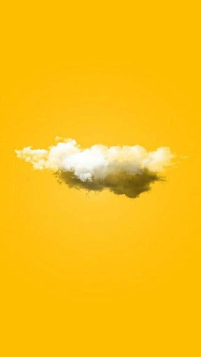 Enmoln På Himlen På En Gul Bakgrund (för En Dator Eller Mobil Bakgrundsbild) Wallpaper