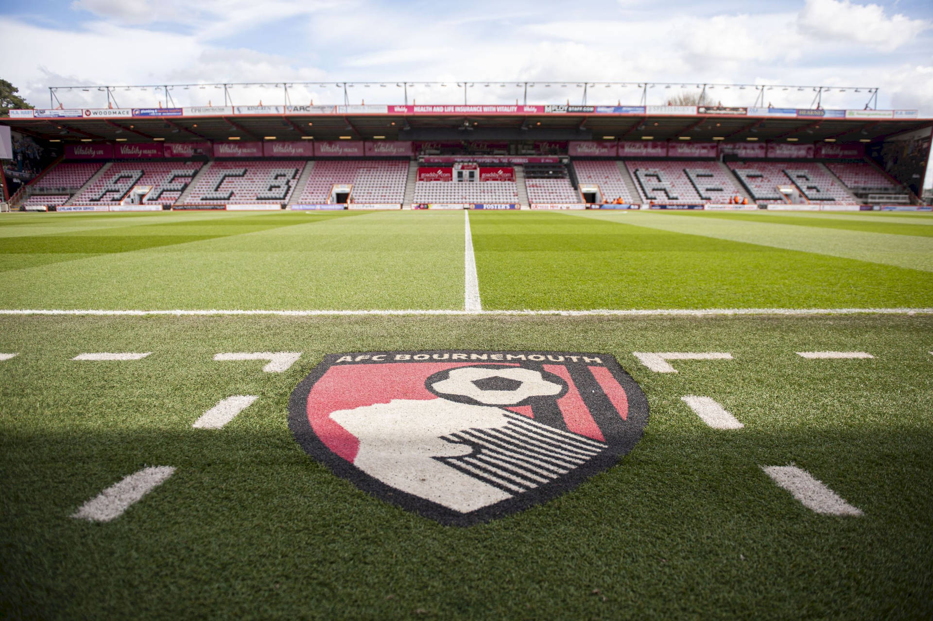 AFC Bournemouth Logo On The Field Wallpaper
