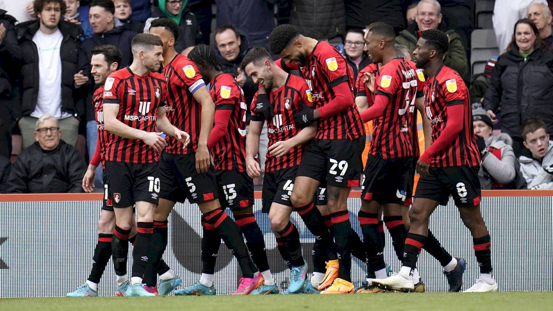 Afc Bournemouth Players Laughing Inside Stadium Wallpaper
