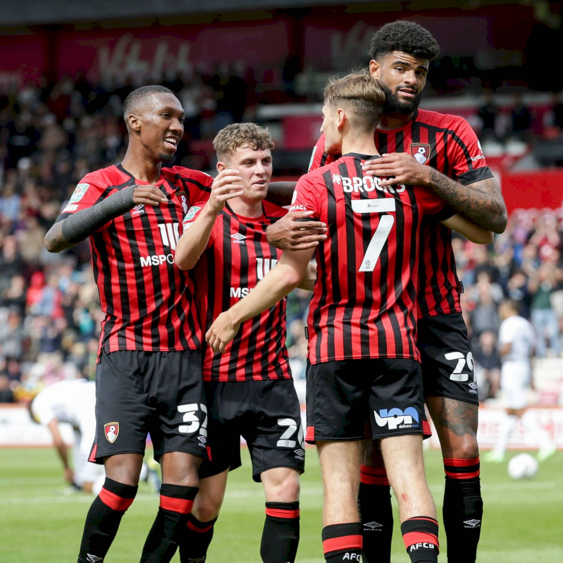 A Cherished Team Moment - AFC Bournemouth Group Hug Wallpaper