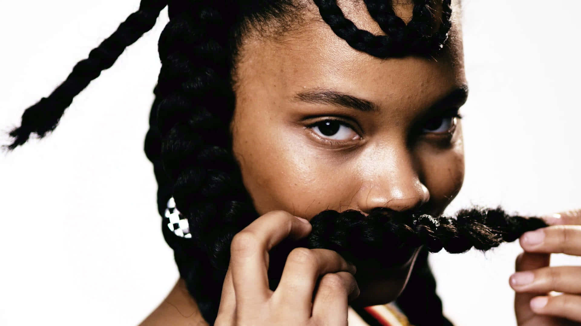 A Young Woman With A Mustache And Dreadlocks