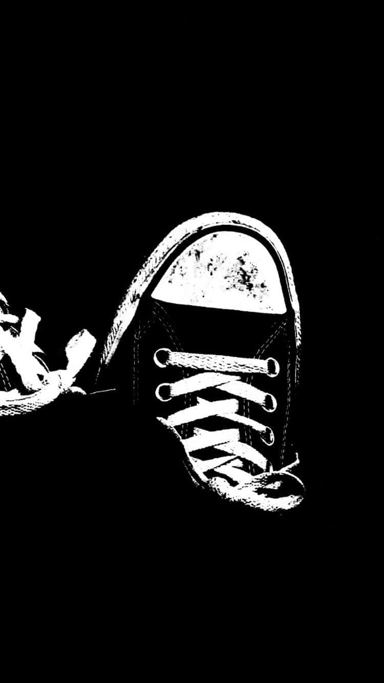 A Black And White Image Of A Pair Of Sneakers Wallpaper