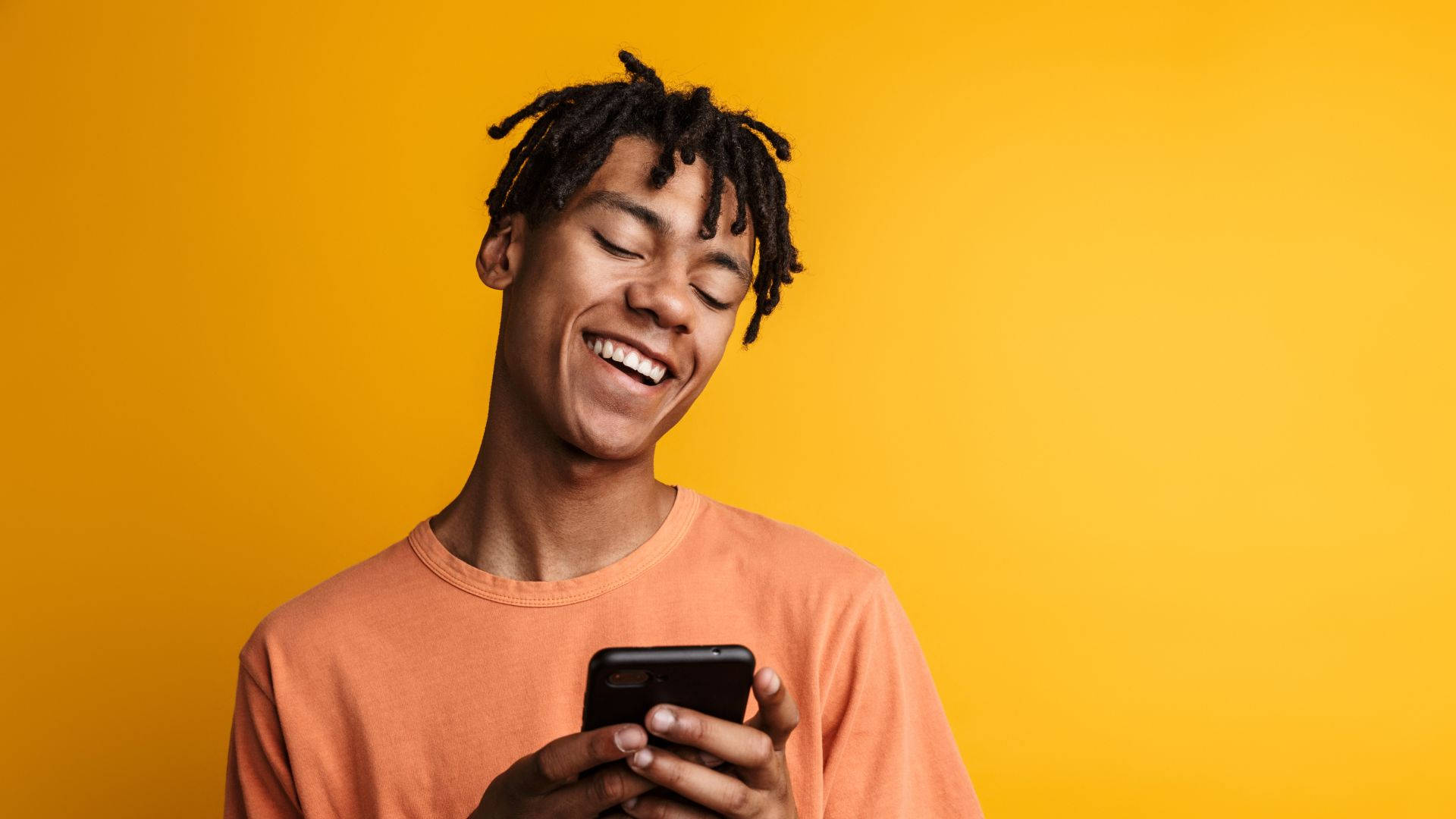 African Man Happy Texting Wallpaper