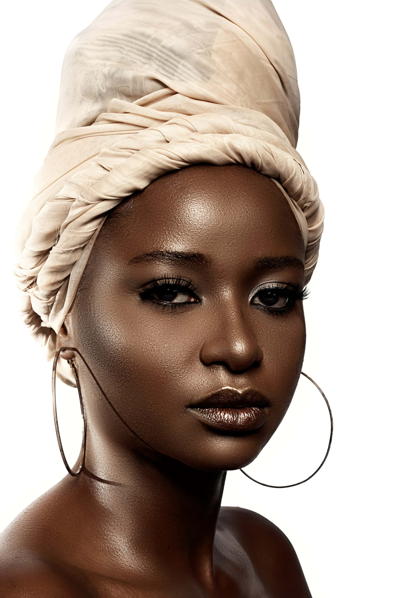 A Black Woman Wearing A Turban