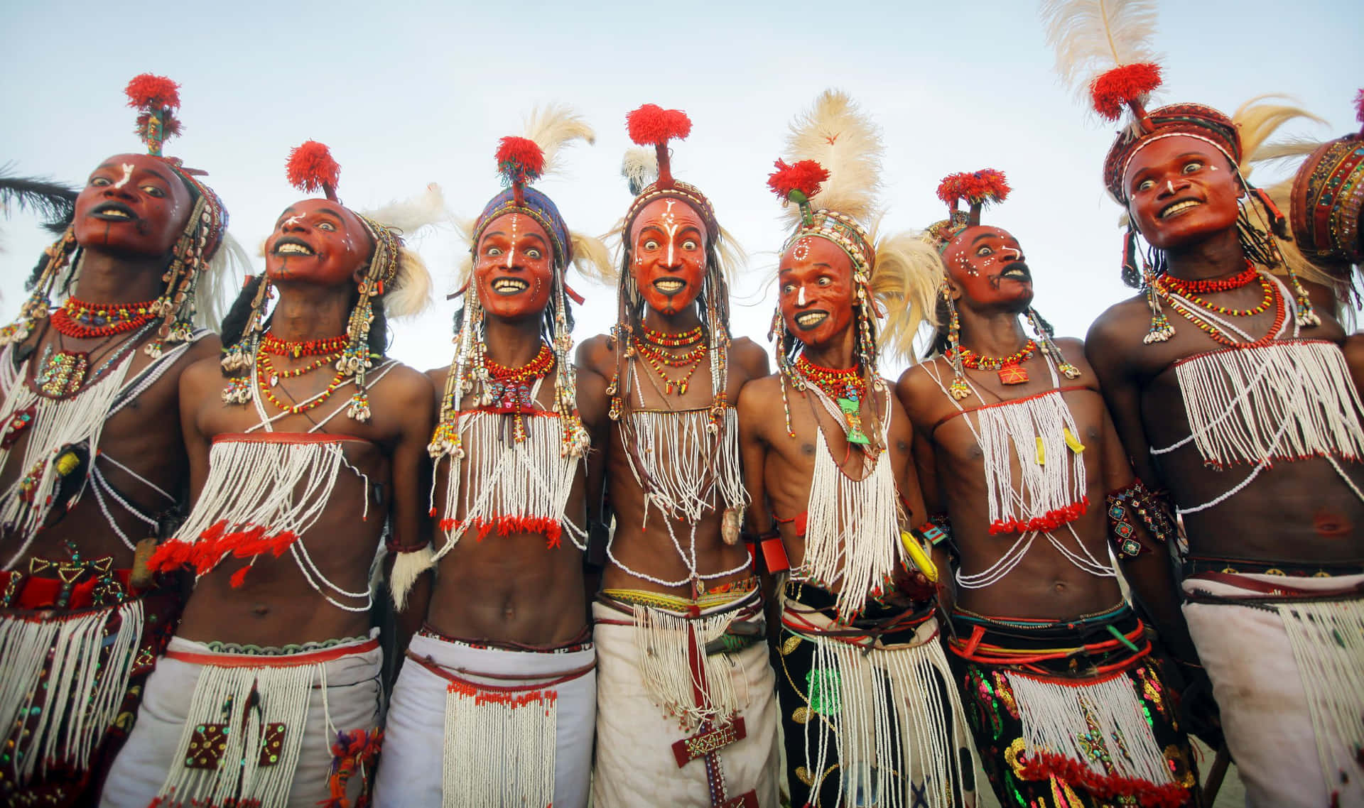 A Group Of Men In Traditional Attire Are Standing Together
