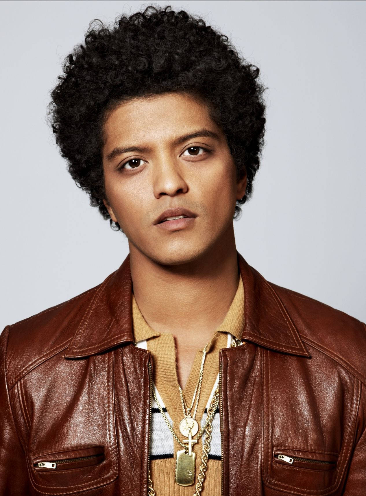Bruno Mars radiating energy with an impressive afro. Wallpaper