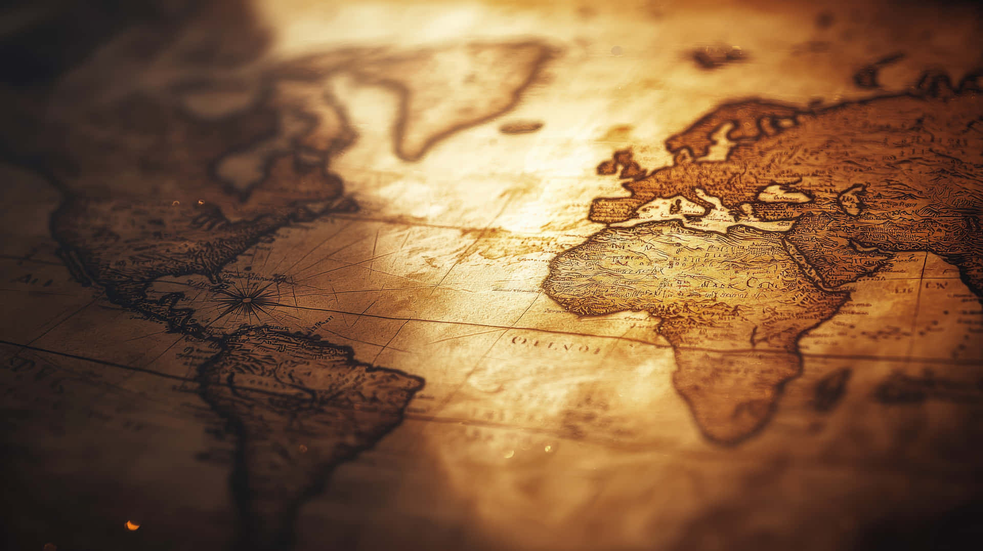 Aged World Map With Intricate Details Illuminated By Warm Light Wallpaper