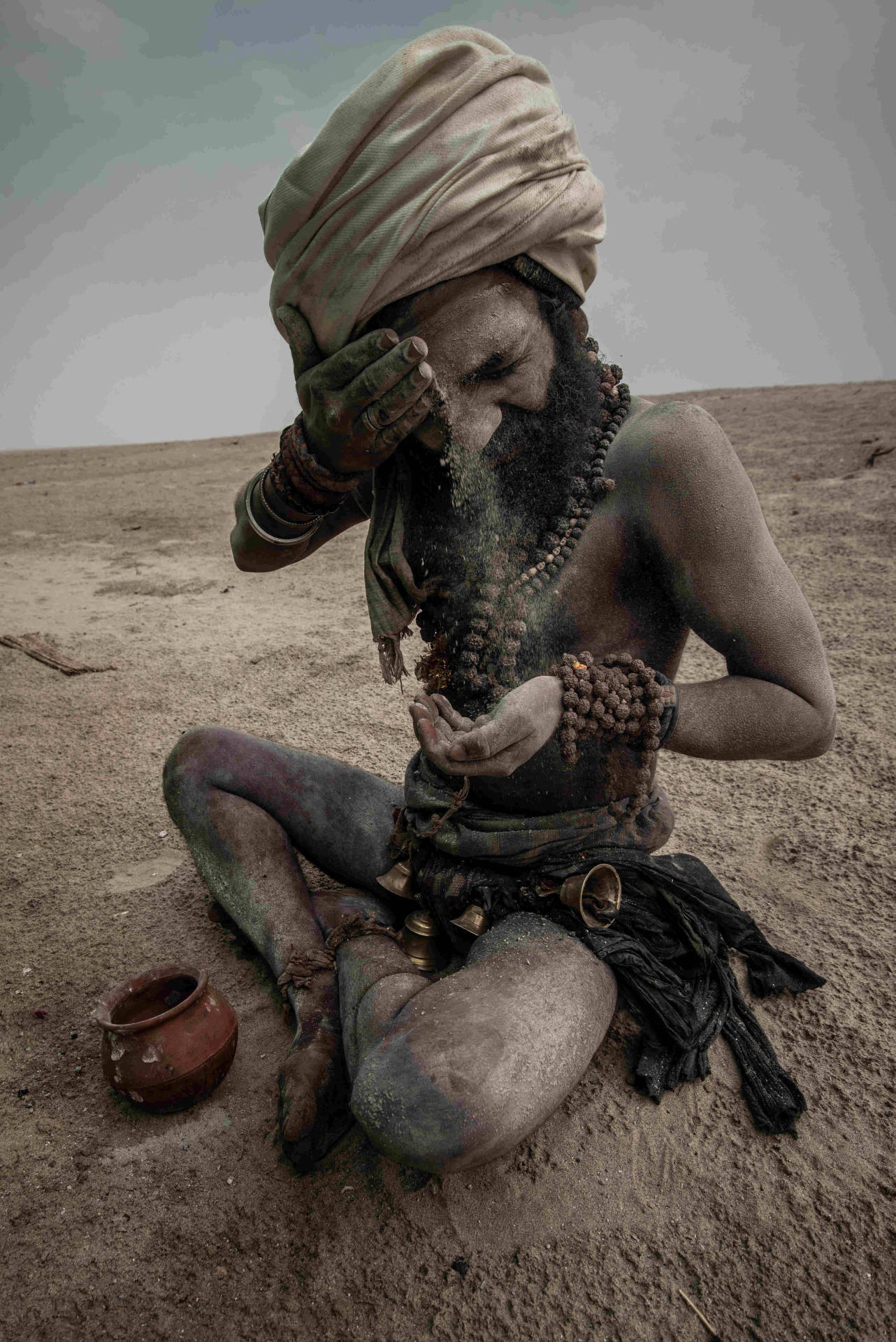 Aghori Painting Himself With Ashes Wallpaper